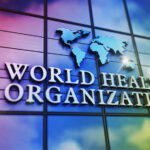 World Health Organization logo on a colorful glass building
