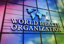 World Health Organization logo on a colorful glass building