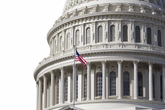 U.S. Capitol dome with American flag flying.
