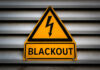 Yellow blackout warning sign with lightning bolt symbol
