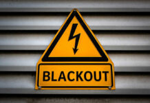 Blackout EXPOSES Fatal Robotaxi Weakness Yellow blackout warning sign with lightning bolt symbol