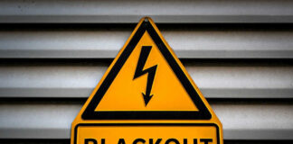 Yellow blackout warning sign with lightning bolt symbol