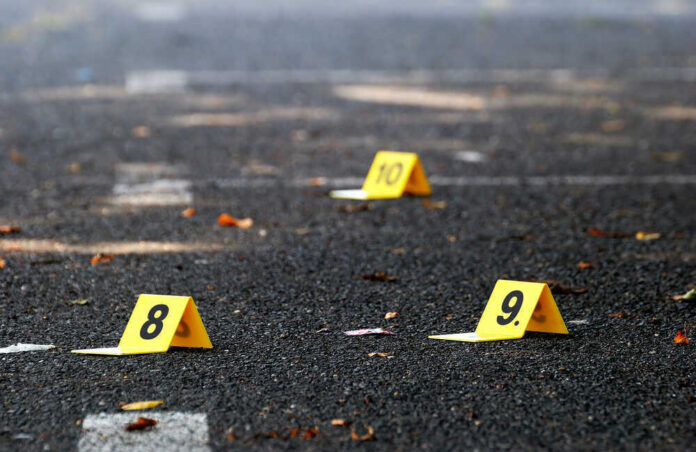 shutterstock_309339200.jpg Yellow evidence markers labeled 8, 9, 10 on pavement.