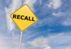 Cheese Giant Hit With Massive Recall Yellow sign with RECALL text against blue sky.