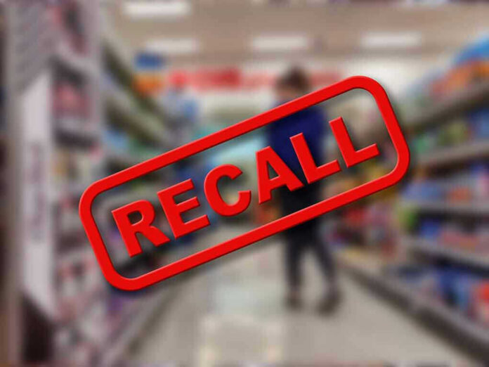 Recall stamp on blurred store aisle background.