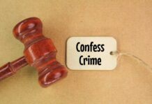 A wooden gavel next to a tag that reads 'Confess Crime'