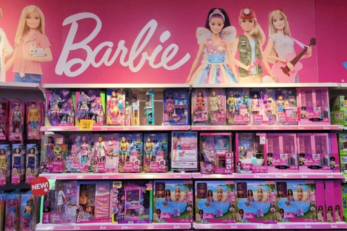 Display of various Barbie dolls and accessories in a retail store