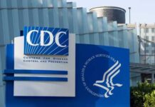 Signage of the CDC building displaying its name and logo