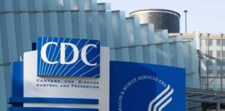 Signage of the CDC building displaying its name and logo
