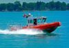 A U.S. Coast Guard boat speeding across the water