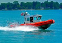 A U.S. Coast Guard boat speeding across the water
