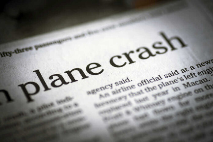 shutterstock_290501621.jpg Newspaper headline about a plane crash.