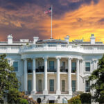 Venezuelan Leader’s White House Visit Shocks World The White House with vibrant sunset sky.
