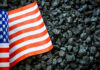 Coal’s Collapse: The Real Cost in McDowell US flag on pile of dark coal rocks