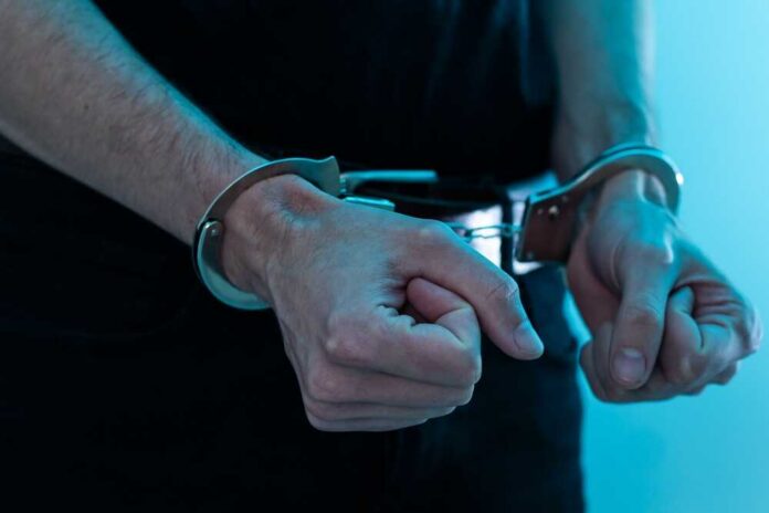 Close-up of hands in handcuffs