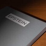 Billionaire RESIGNS — Epstein Files Force Him OUT Close-up of a metallic binder labeled 'EPSTEIN'