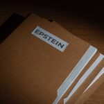 Stack of brown file folders labeled 'EPSTEIN'