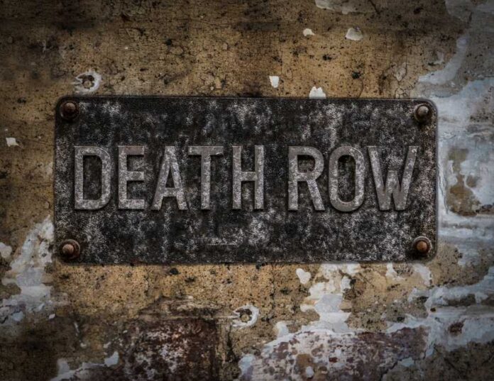 Weathered metal sign reading 'DEATH ROW' on a wall