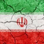 Cracked texture of the Iranian flag with green, white, and red colors