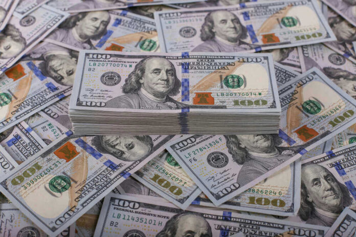 Stack of one hundred dollar bills, Benjamin Franklins portrait.