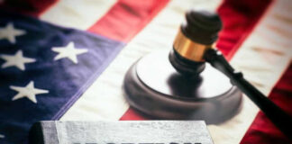 Book titled Abortion Law with gavel and American flag.