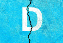 White letter D on cracked blue surface.
