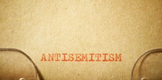 Typewritten text reading 'ANTISEMITISM' on paper