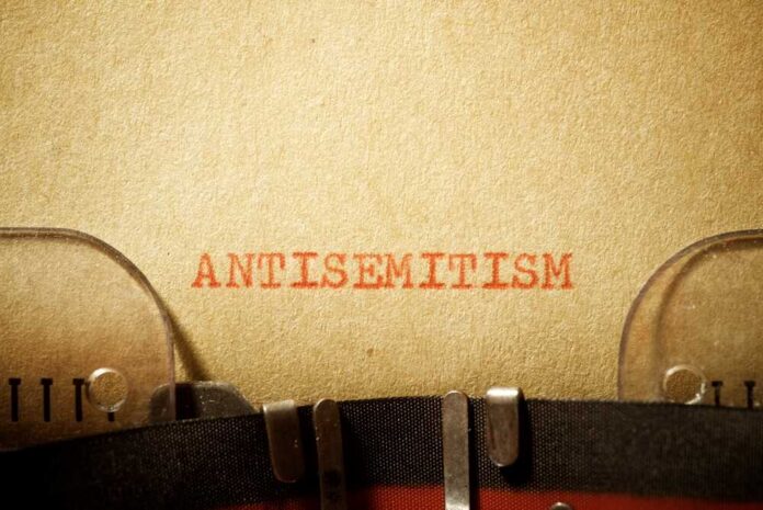 Typewritten text reading 'ANTISEMITISM' on paper
