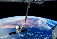 View of Earth from the International Space Station with a satellite in focus