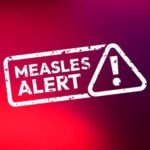 Measles alert warning sign with exclamation mark