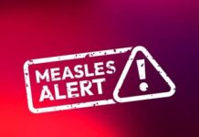 Measles alert warning sign with exclamation mark
