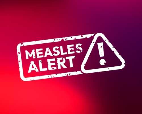 shutterstock_2596522657.jpg Measles alert warning sign with exclamation mark