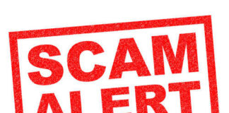 Red stamp with the words SCAM ALERT in bold letters