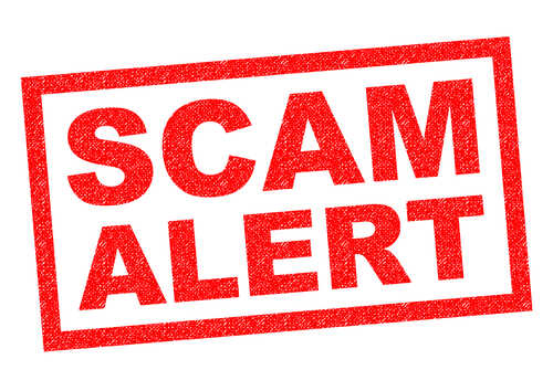 Red stamp with the words SCAM ALERT in bold letters