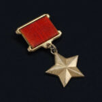 ROTC Cadets Awarded For Heroism While Killing Terrorist Gold star medal with a red ribbon.