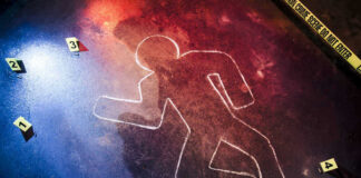 Crime scene chalk outline with numbered evidence markers.