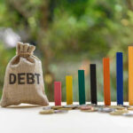 Restaurant Empire CRUMBLES — Debt Avalanche Debt sack with rising financial graph bars.