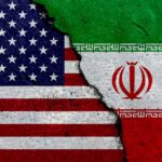 Trump’s Latest Iran Decision Stuns Washington A cracked surface displaying the flags of the USA and Iran