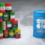 OPEC Bombshell: Major Supplier Quits A stack of colorful oil barrels representing different countries next to an OPEC barrel