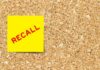 ALERT: 3.1 Million Bottles Recalled Yellow sticky note with the word 'RECALL' on a corkboard