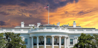 The White House with vibrant sunset sky.