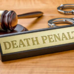 Death Sentence Ordered: FedEx Driver’s Gruesome Crime Gavel handcuffs and death penalty sign on table