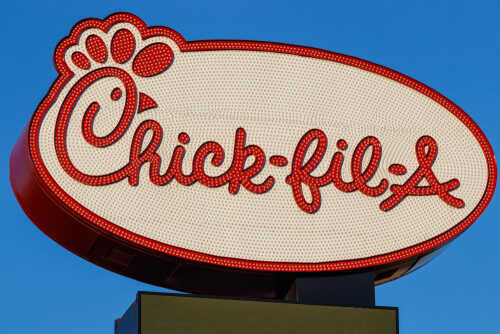 Las,Vegas,-,Circa,June,2019:,Chick-fil-a,Retail,Fast,Food Chick-fil-A restaurant sign illuminated against a blue sky