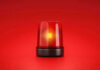 Diving Mystery: Who Knew the Deadly Plan? Red emergency light on solid red background.