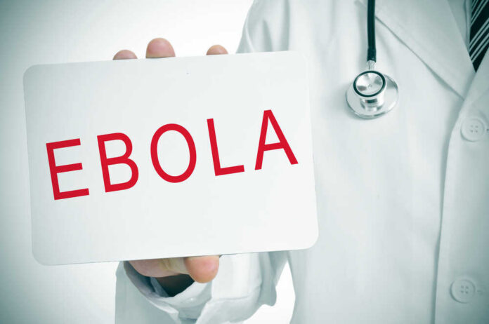 Doctor holding a sign about Ebola