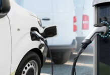 EV Launch Sparks Outrage — Billions Lost! Electric vehicle connected to a charging station