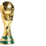 FIFA’s Shocking Halftime Show Twist Golden trophy representing the World Cup held by hands
