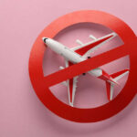 Power Bank Confession FORCES Emergency Landing! Airplane inside red prohibition sign on pink background.