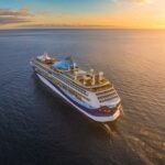 HORROR: Cruise Becomes Death Trap A cruise ship sailing on calm waters during sunset