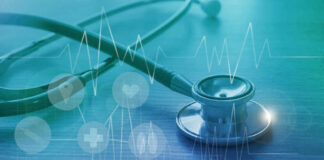 A stethoscope on a wooden surface with digital health icons and a heartbeat graph overlay